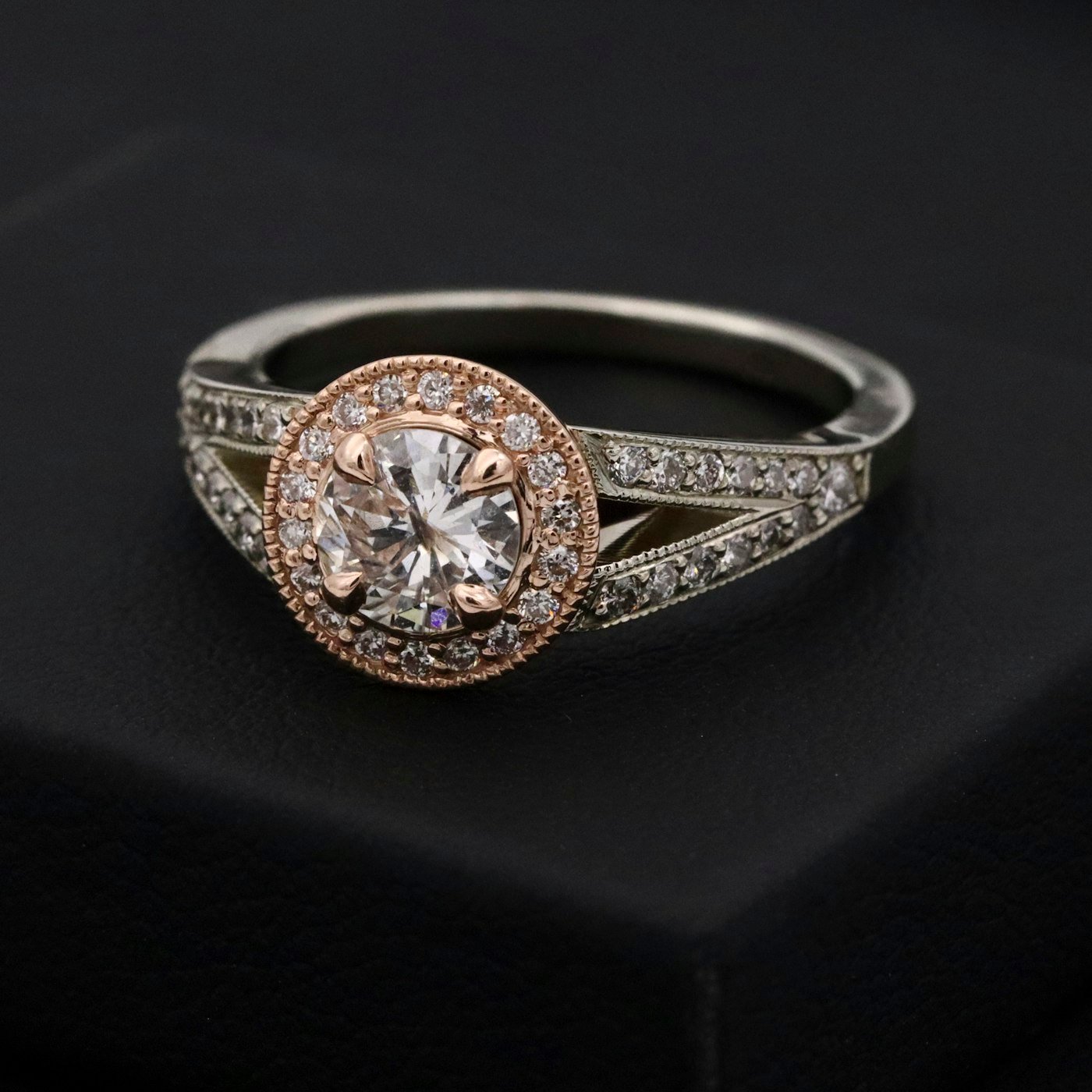 Natural diamond engagement ring in a dark presentation box