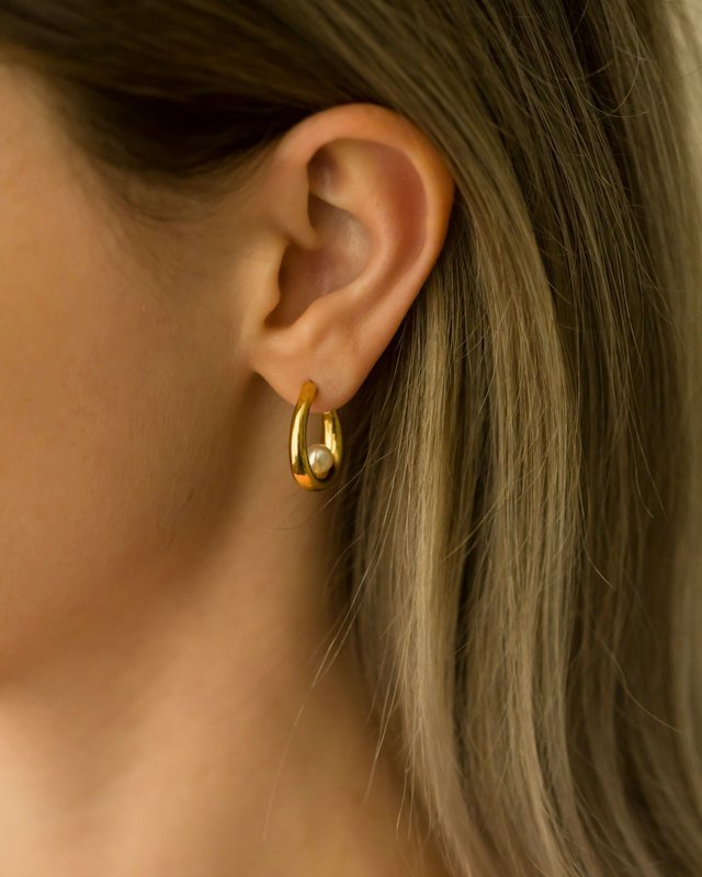 Close-up of a gold drop earring