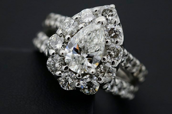 Diamond ring resting on dark textile