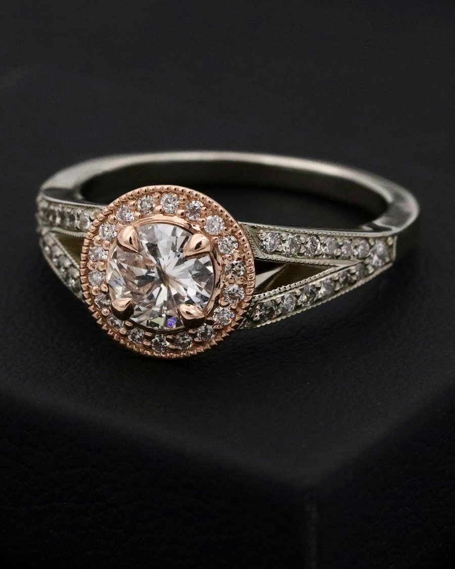 Natural diamond ring in a dark presentation box