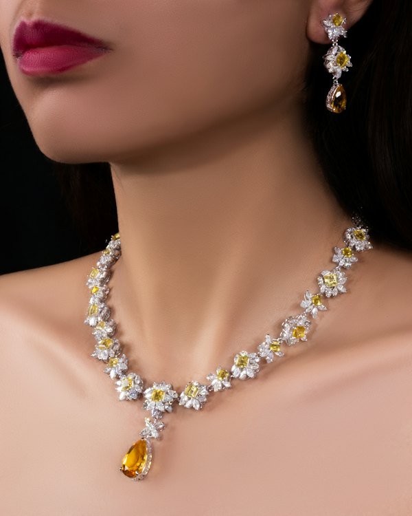 Diamond necklace and earrings worn with an elegant neckline