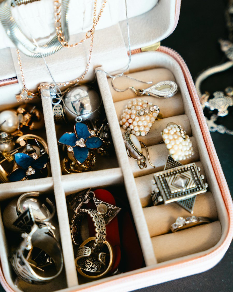Open jewelry box with necklaces, rings and earrings