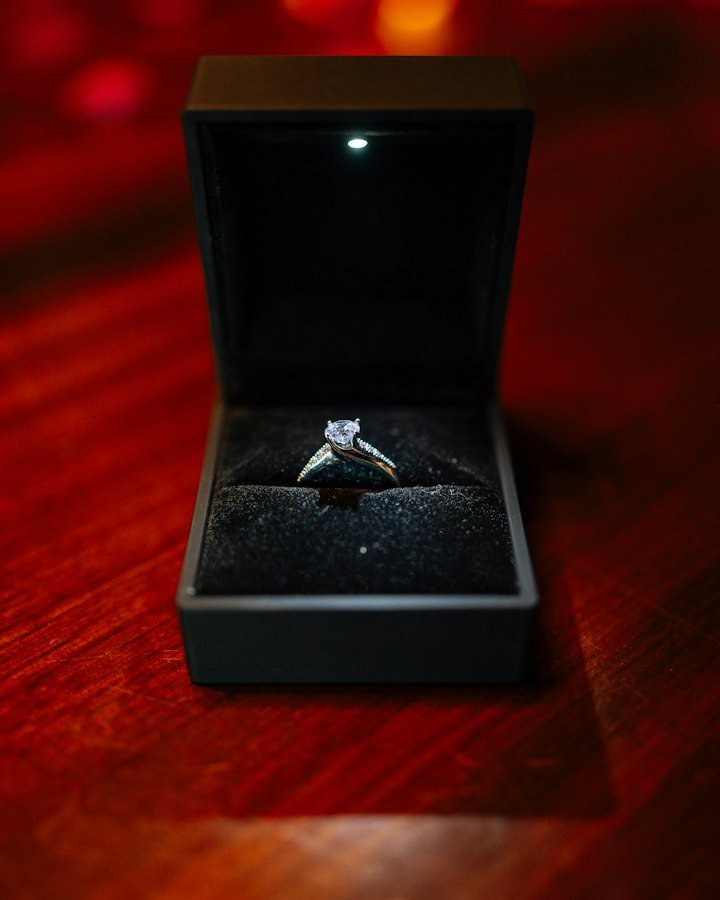Diamond engagement ring in an open ring box