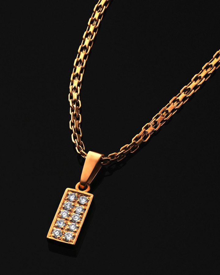 Gold necklace with a rectangular diamond pendant