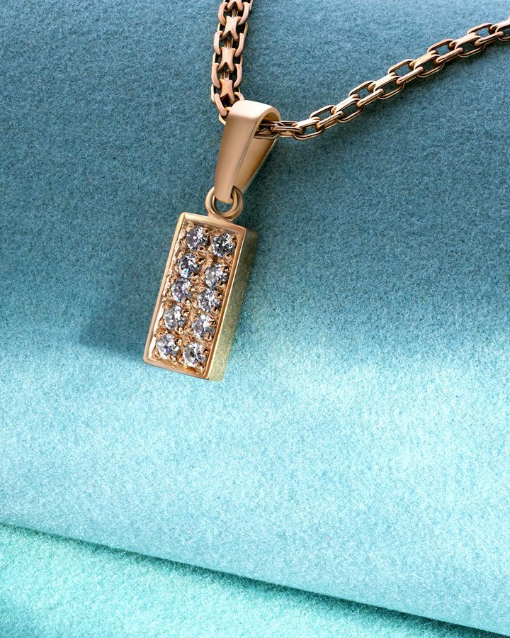 Gold pendant with diamonds on a fine chain